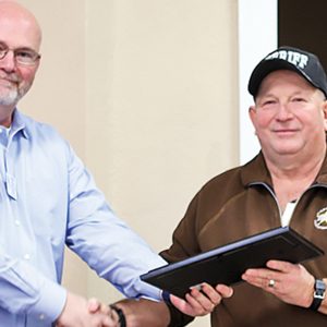Harrodsburg Rotary President Barry Steele presents Mercer Sheriff Ernie Kelty with a certificate of appreciation--the Harrodsburg Herald.