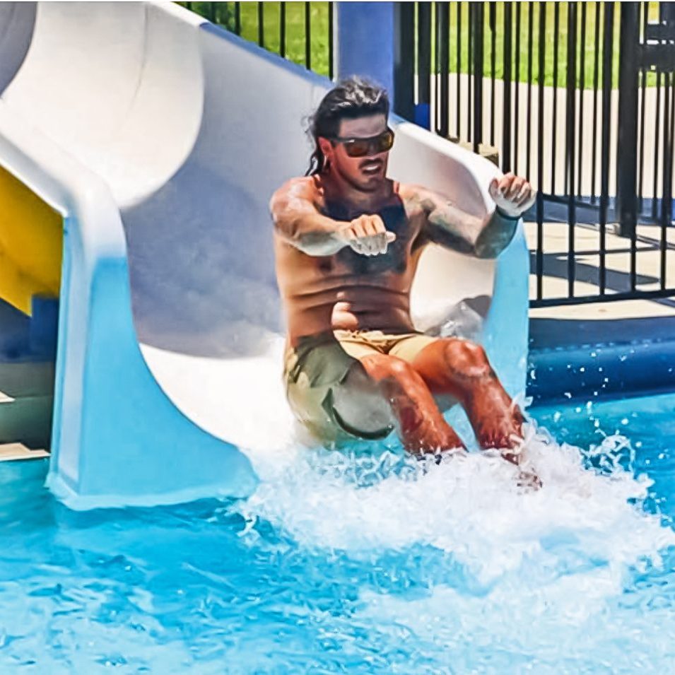 The Harrodsburg Herald/April Ellis Kids aren’t the only ones having fun on the slide at the pool at Anderson Dean Pool, adults enjoy the slide too. 