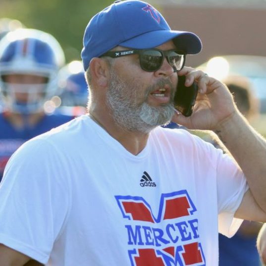 Photo Submitted Brian Sims has been a mainstay for the Titans football program for the past 10 years, doing everything from painting the field to serving as special teams coordinator.